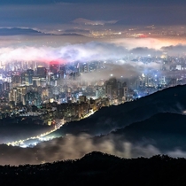 Gangnam District under a sea of clouds surrounded by mountains Seoul South Korea 