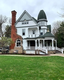 George F Winslow House a Queen Anne Victorian built in  with an oversized corner brick chimney that wraps around a window Eau Claire Wisconsin