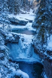 Half frozen waterfall in Banff National Park Canada 
