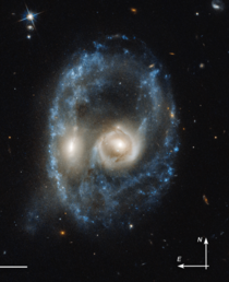Happy Halloween Menacing-looking face formed by titanic smashup between two galaxies captured by the Hubble Telescope