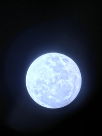 Heres my photo of the Friday th moon with an iPhone and a  telescope but with a blue filter   