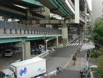 Highway overpasses over a street in Tokyo Japan