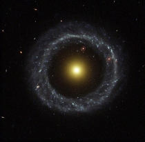 Hoags Object - a ring galaxy discovered in  by astronomer Art Hoag who initially thought it to be a planetary nebula A nearly perfect ring of hot blue stars pinwheels about the yellow nucleus of this unusual galaxy 