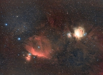 Horsehead on the left and Orion nebula on the right using a DSLR camera and lens from my backyard
