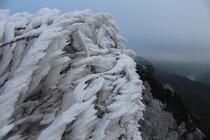Humid wind meets cold mountain top Saxon Switzerland Germany  