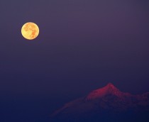 Hunters Moon the second Full Moon after the northern hemisphere autumnal equinox over Rochemelon in the Italian Alps 