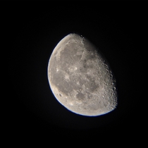 I took a photo of the moon with an iPhone s and with Telescope model  low budget photo