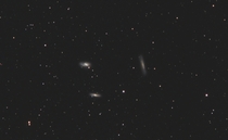 I took  images to reveal  galaxies over  million light years away The Leo Triplet as it is known are in a cosmic dance as their gravitys tugs on one another