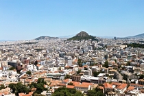 I took this photo from the Acropolis of the Athens city-sprawl That is a monastery on the mountain top 
