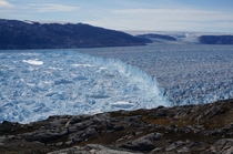 Ice cliff at the terminus of Helheim Glacier Greenland in August  by Knut Christianson 