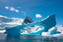 Iceberg and mountains along the Antarctic Peninsula  photo by David C Schultz