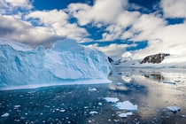 Icebergs Brash Ice and Mountainous Terrain on the Gerlache Strait Antarctic Peninsula Antarctica - By Adam Burton 