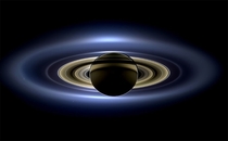 In a natural color mosaic Saturn eclipses the Sun as seen by NASAs Cassini spacecraft on July   Earth is barely visible as a single pixel just below the main rings and to the right of the planet 