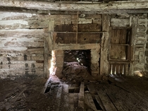 Inside the home of my great-grandaunt who passed away in  This is a hand-hewn log structure daubed with clay chinking It has a chimney made from large fieldstones It was built in the mid th century in rural Virginia and now sits in my neighbors cow field 