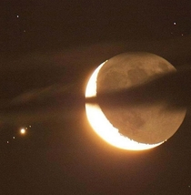 Jupiter and  of its moons dance with the moon in the night sky in an event known as the occultation of Jupiter 