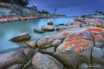Just after sunset on a cloudy evening at Binalong Bay in the Bay Of Fires Tasmania Australia 