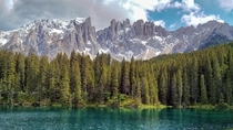 Karersee Lake Carezza with a view of the Latemar mountain range 