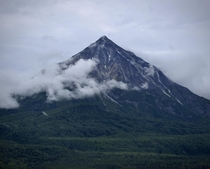 King Mountain rising through the clouds Alaska 