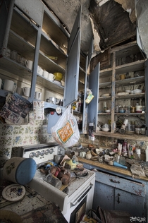Kitchen Cupboards With Everything Left Behind Inside a Very Dangerous Abandoned House in Rural Ontario 