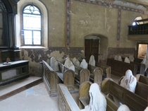 Kostel Svatho Ji Ghost Church - in the middle of a rural area of Czechia this -year-old church has been slowly falling apart - the local village decided to set up ghosts in memory of people who lived here before WWII - people come in from across the count