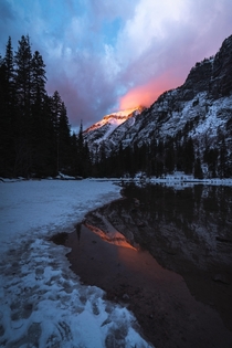Last light blowing up the peaks at Avalanche Lake in Glacier National Park 