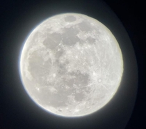 Last nights full moon Meade DS- Picture taken with my iPhone SE  Im very new to all this but Ive always been fascinated with space Sorry for the bad quality Im still learning
