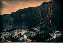 Lava creeping down the Big Island cliffs Hawaii 