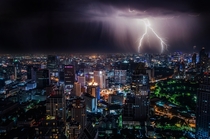 Lighting storm at night over Bangkok Thailand Photo credit to Dominik Qn
