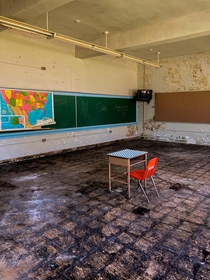 Lonely desk inside of an abandoned school  IG jaysforbiddenexplorations