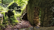 Long-abandoned ruined cottage by the river at Cei Bach Wales