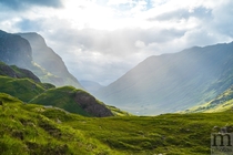 Looking down Glen Coe Scotland after an overcast day The clouds parted for a moment and got some spectacular light 