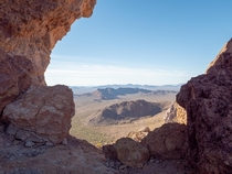 Looking out through a natural window in the Little Ajo Mountains Arizona 