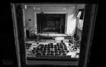 Looking through the projector opening at this abandoned auditorium
