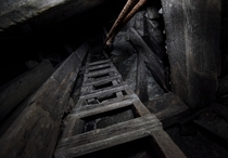 Looking up a ladder in an abandoned mine 