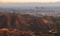 Los Angeles skyline and the Griffith Park Observatory during golden hour 