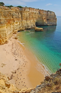 Marinha Beach southern coast of Portugal  by Juampiter via Getty Images