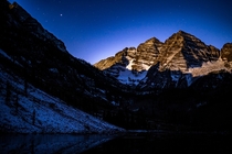 Maroon Bells near Aspen CO There was a pretty full moon at the time so it left an interesting effect 