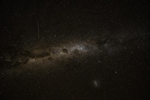 Milky Way band across the southern hemisphere night sky with a dwarf galaxy taken at Tekapo New Zealand 