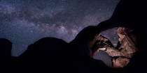 Milky Way setting behind the Double Arch at Arches National Park in Moab Utah 