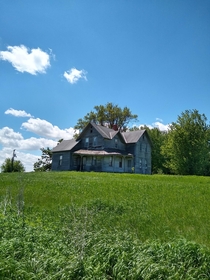 MN farmhouse under blue sky