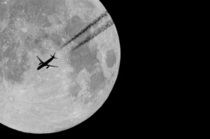 Moon with plane captured a few years ago in city from home