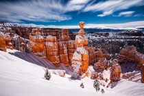 Moonlit Bryce Canyon covered in fresh snow - this looks like a daylight photo but is actually a min exposure taken at night during a full moon 