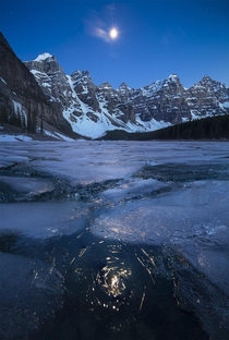 Moonrise over a frozen Reddit Lake Canada OC x
