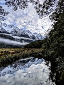 Morning Mist in the Mountains at Mirror Lakes Fiordland National Park New Zealand 