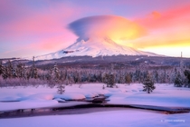 Mount Hood Meadow Lenticular cloud forms over Mount Hood in a snow covered meadow at sunrise Oregon USA    Photographed by Jarrod Castaing 