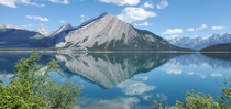 Mount Indefatigable reflected in upper Kananaskis Lake Alberta  x  