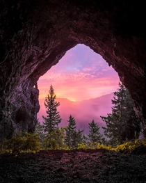 My friend and I hiked in to spend the night in Boca Cave In the morning we woke up to a very dense fog obscuring everything However for a brief moment it lifted and we got to see this sunrise A very memorable camping trip 