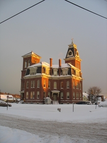 My victorian grammar school in the s in Manchester NH USA  by early winter snow