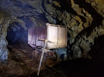 Mysterious ore cart inside an abandoned mine 