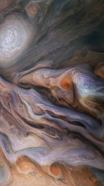 NASAs Juno spacecraft was  miles above the cloud tops when it snapped this picture of swirling clouds